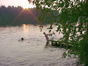 swimming zwemmen summer cottages zomerhuisjes - skandinavia - skiing, snowboarding, dogsleds, snow mobiles, trekking, fishing, swimming and sauna holidays - vacations in your own cottage in south east Finland - summer, fall, autumn, winter and spring at Penttilä Gardens